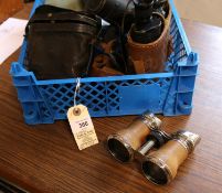 2 pairs of vintage binoculars, one is of military issue and comes with its original leather case,
