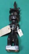 A very unusual and interesting hand carved figure in possibly ebony of what is believed to be a