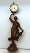 A very well cast bronze figure of an Art Nouveau style lady holding a small watch contained in a