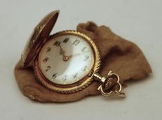 A 14k gold small ladies fob watch, rear case opens and is hall marked 14k with serial numbers and