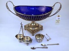 A large silver plated on copper centre piece fruit bowl, in a basket style with blue glass liner, no
