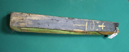 A painted small railway sleeper from Mexico city, depicting the black Virgin Mary of Guadalupe.