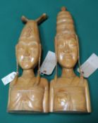 A fine pair of Bali Keradginan carvings of a woman's head and body, well defined, both with long