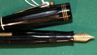A 1930s Parkette Deluxe Fountain pen, Made in Canada. 14k gold nib. Comes with a business card dated