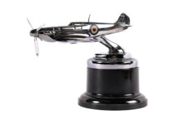 A scarce SPITFIRE car mascot with the original chrome plating. Has intact roundels and a working