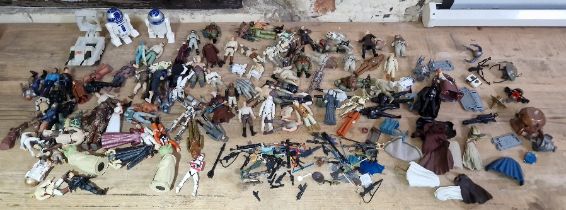 A box of assorted vintage & modern Star Wars figures, weapons & clothes.
