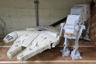 Two vintage Star Wars vehicles comprising Millenium Falcon & an AT-AT.