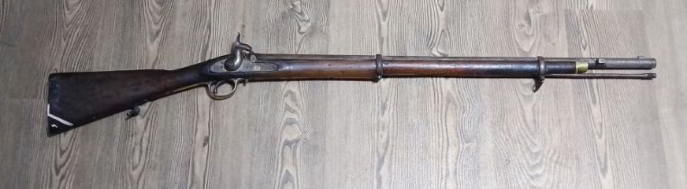 An antique percussion rifle, stamped 'TOWER 1870' and crown to side plate, length 124cm.