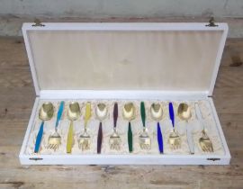 A cased set of Norwegian Sterling silver gilt and enamel spoons and forks by Jacob Tostrup.