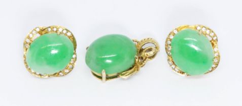 A jadeite jade cabochon pendant and matching earrings set with colourless stones, all pieces