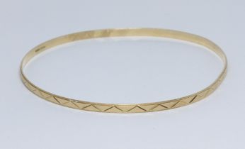 An eastern yellow metal bangle, marked '750' also with Italian marked, diameter approximately 7cm,