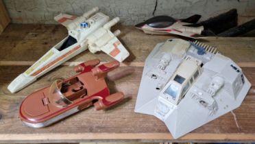 A group of three vintage star wars vehicles comprising a snowspeeder, an x-wing fighter & Luke