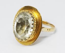 A yellow metal rock crystal quartz ring, marked 'C18' and also with unascribed foreign marks,