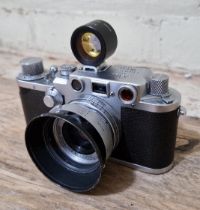 A Leica D.R.P Ernst Leitz Wetzlar 35mm camera, serial no. 432649 with a Wetzlar lens no. 1450935,