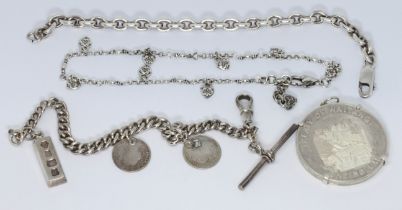 Two silver chains, another bracelet and a commemorative silver coin, gross weight 86g.