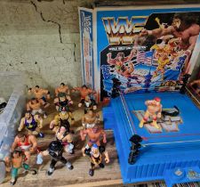 A group of sixteen vintage WWF figures to include Hulk Hogan, the Undertaker, Bret Hart, Sgt