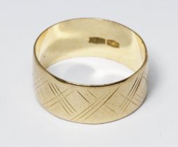 A yellow metal wedding band, marked '750', weight 2.6g, size L. Condition - good, minor wear only.