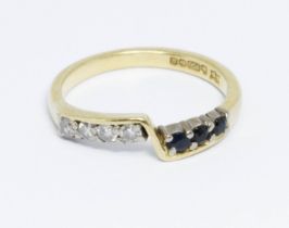 A hallmarked 18ct gold diamond and sapphire ring, gross weight 2.8g, size K.