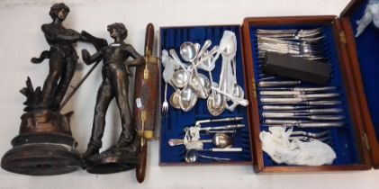A wooden canteen of cutlery, a carving set and two spelter figures.