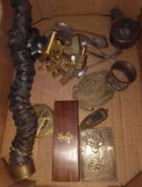 A box of collectables to include a horn, sextant, belt buckles, compass, a brass pin cushion,