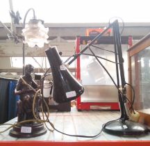 A figural lamp and an anglepoise lamp.