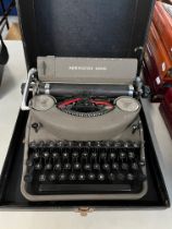 A vintage Remmington Rand Noiseless typewriter in case.