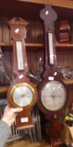 A 19th century mahogany barometer and a reproduction barometer.