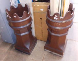 A pair of chimney pot crowns.