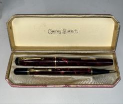 A Conway Stewart fountain pen and pencil set, in original case. Fountain pen nib marked 14k gold