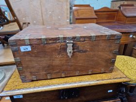 An Indian teak and brass bound box with fitted interior.