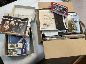 A box of postcards and a box of cigarette/tea cards and albums