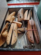 A box of shoe stretchers, some vintage.