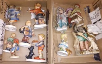 A box of Goebel figures and a box of pottery figures.