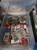 A box of vintage cigarette packets.