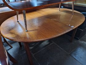 A mid 20th century teak extending dining table.
