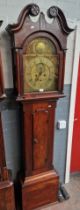 A George III mahogany longcase clock with brass dial marked John Allan Irvine, weights and pendulum.