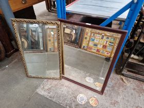 A gilt framed mirror and a mahogany framed mirror.