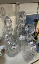 5 lead crystal decanters including one by Tyrone Crystal, Ireland, together with 4 ceramic