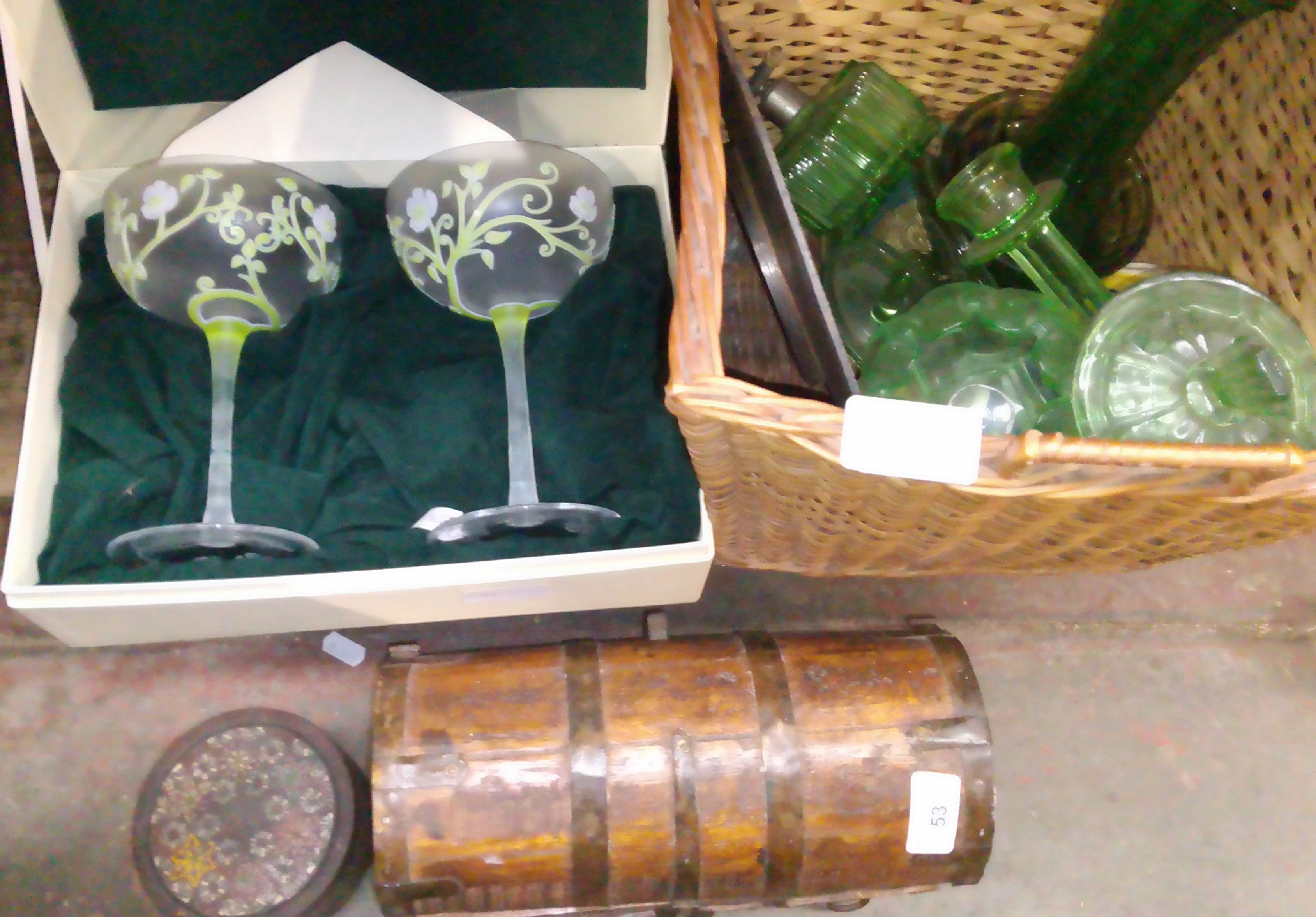 A mixed lot comprising an eastern casket, a wicker basket with green glass and a pair of Perrier