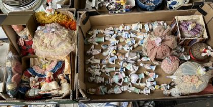 Box of porcelain pin cushion dolls and a box of costume dolls