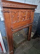 An Edwardian oak fire surround, height 188cm and width 143cm.