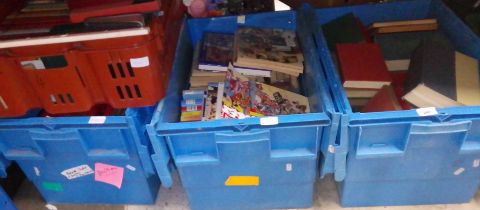 Four boxes of assorted books and annuals.