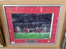 A framed Liverpool FC photograph, signed by Tommy Smith.
