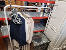 A vintage mid 20th century clothes rail by R W Bamforth, with associated hangers and 3 coats and
