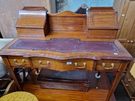 An Edwardian inlaid mahogany writing desk.