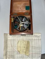 A cased anemometer, number 7157, with standard comparisons sheet and correction sheet