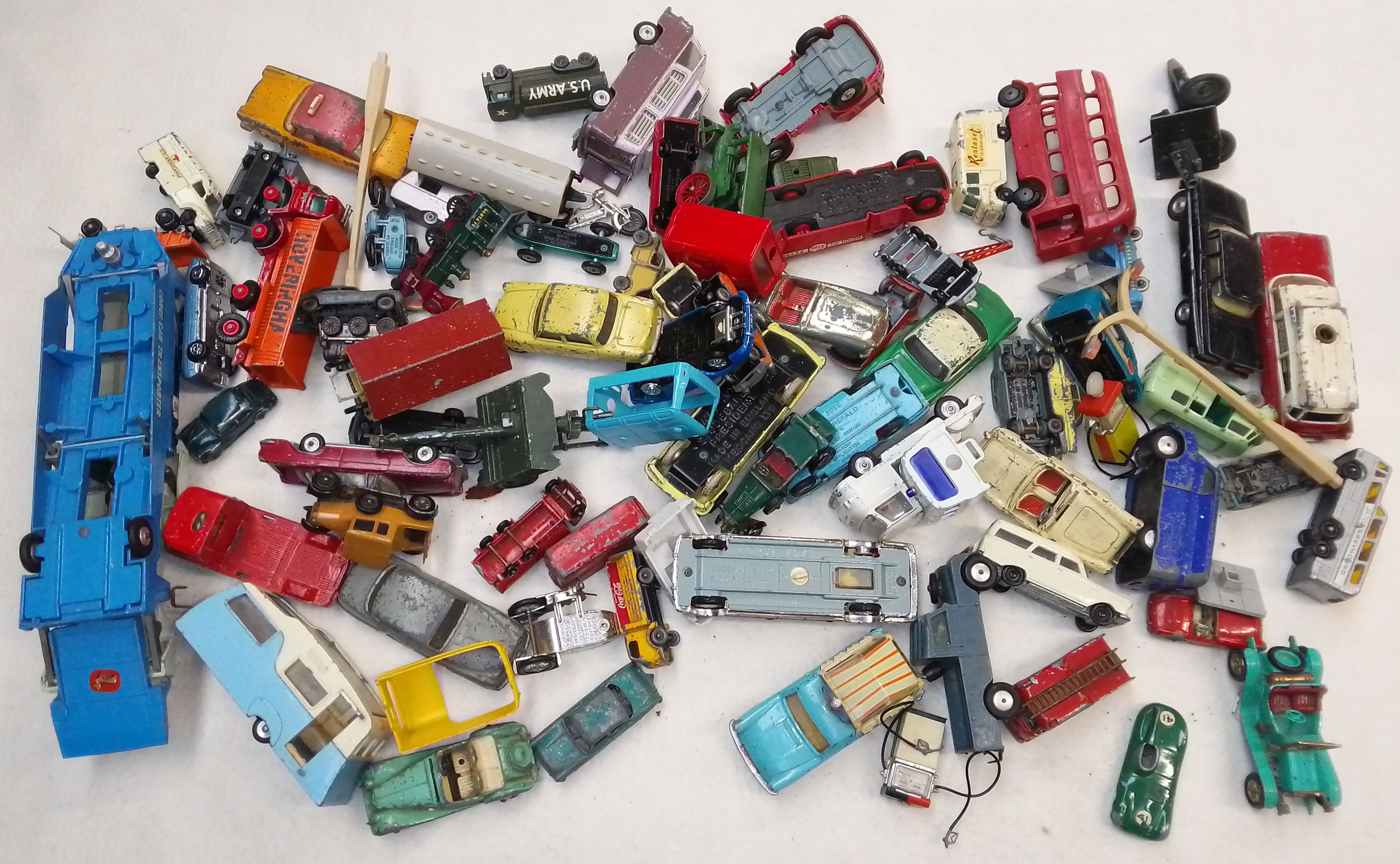 A box of die cast model vehicles including Dinky and Corgi.