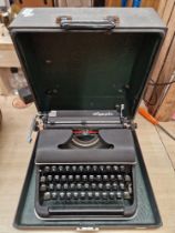 A vintage Olympia portable typewriter.