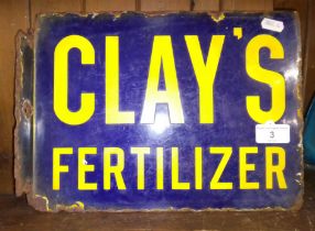 A vintage double sided enamel sign "Clay's Fertilizer".