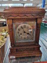 An oak cased bracket clock, with keys & pendulum.